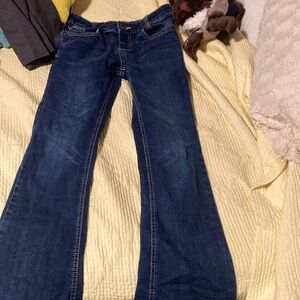 bootcut kid jeans , Design on back , size 12 , And Only used like 5-7 times
